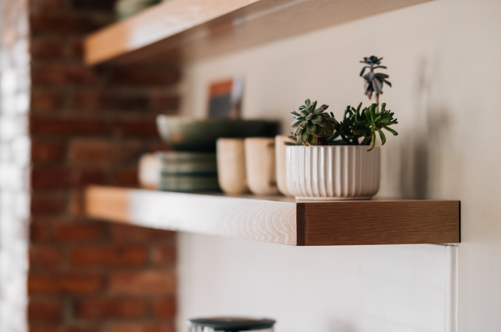 side view of white oak floating shelves with decor