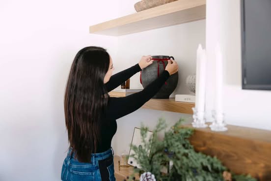 adding decor to floating shelves